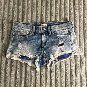 Blue distressed shorts